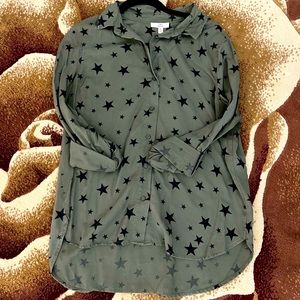 Gently used blouse, dark green colors with stars.